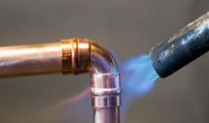 Monterey Bay plumbing contractor sweats copper pipe